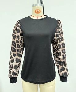 Detail showing the leopard print bubble sleeve contrast on a black long sleeve tee