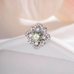 Elegant silver flower earring with green zircon and sparkling clear accent stones