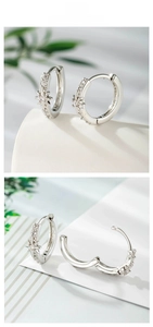 Macro shot of silver star hoop earrings with micro-pave cubic zirconia crystals