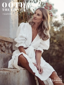 Detail of white puff sleeve tie-front top and tiered skirt with V-neckline texture