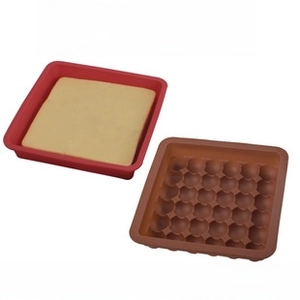 Square silicone baking mold with honeycomb base design for cakes in red and brown colors