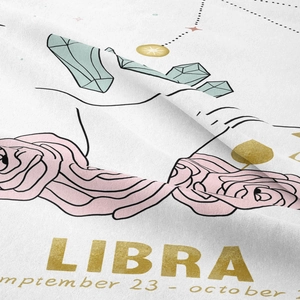 Close-up of Libra zodiac tapestry featuring soft fabric texture and gold floral prints