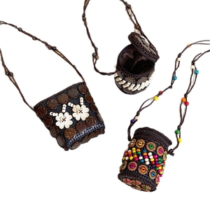 Handmade Bohemian coconut shell woven mini crossbody bag with ethnic beadwork for women