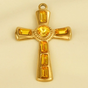 Detailed view of a gold stainless steel cross pendant with yellow crystals and top ring