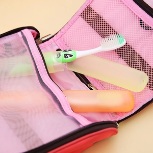 Pink portable travel mesh wash bag with breathable compartments for toothbrush storage