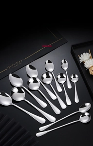 Macro shot of mirror-polished stainless steel spoon set in different shapes and sizes