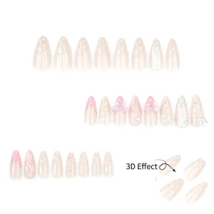 Faux ongles French roses avec perles 3D, nœuds papillon et textures de coquillage