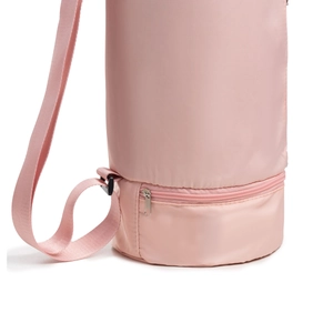 Detailed close-up of pink yoga mat bag featuring bottom zipper compartment and strap
