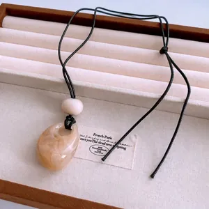 Vintage style amber waterdrop acrylic pendant necklace with black wax cord for women