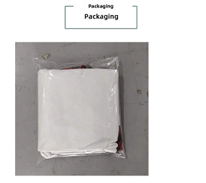 Detailed view of a classic red and black plaid Christmas tree skirt in clear plastic packaging