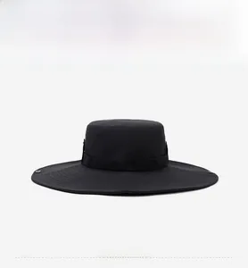 Close-up of a black wide brim sun hat with breathable fabric and metal side buckles