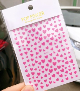 Detailed view of Me017 pink glitter heart 3D design nail sticker in packaging