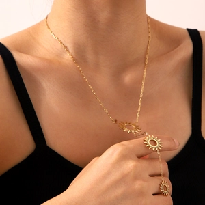 Gold hollow sunflower Y-necklace in stainless steel displayed on a female model