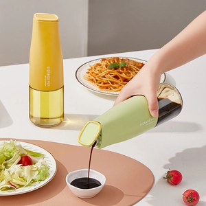 Auto gravity flip glass oil dispenser bottle set in green and yellow for kitchen use
