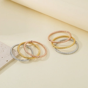 French style twisted and diamond-cut texture stainless steel bangle set in three tones