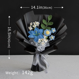 Handmade knitted flower bouquet with blue lilies and white accents in black wrapping paper