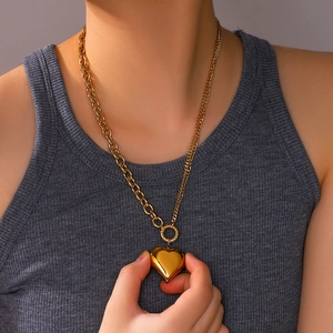 Gold-plated 18k stainless steel double heart pendant necklace worn by a female model
