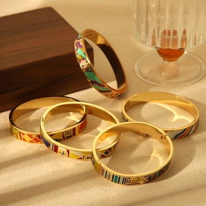 Chic 18k gold-plated enamel bangle featuring vibrant geometric patterns and secure clasp