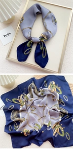 Detail of silk square scarf featuring vintage chain patterns in navy and light purple