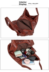Detail view of large tote bag interior showing dual compartments and central zipper pocket
