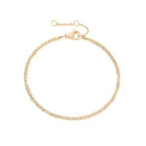 Detail of gold double-layer chain bracelet featuring a lobster clasp and extension
