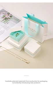 Detailed set of premium white jewelry boxes and matching gift bag with luxury ribbon
