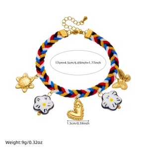 Handwoven colorful rope bracelet with gold-tone heart and ceramic flower pendants