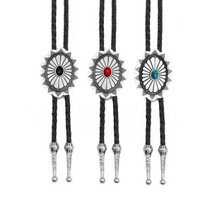 Three Celtic hip-hop bolo ties with black, red and turquoise stones on braided leather cords