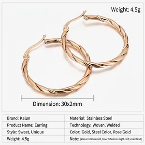 Detailed macro view of 30mm rose gold stainless steel hoop earrings with twisted design