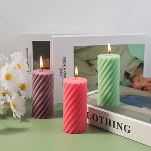 Spiral textured pillar aromatherapy candles in purple, pink and green for home decor