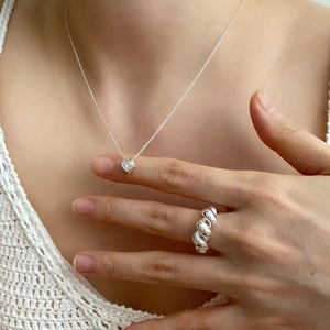 925 sterling silver heart necklace and croissant ring set worn by model