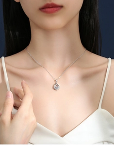 On-model view of an elegant S925 silver flower pendant necklace with round moissanite
