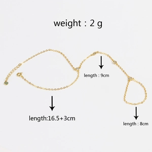 Detail view of 18k gold plated bracelet ring with clear stones and heart pendant dimensions