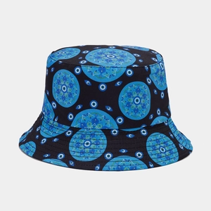 Detail of vintage black bucket hat featuring blue mandala and evil eye pattern embroidery