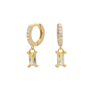 Detail of gold geometric hoop earrings featuring rectangular yellow gemstone pendants