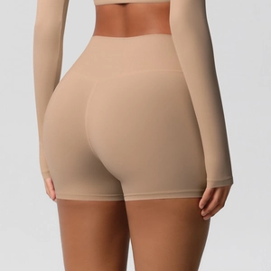 Rear view of beige high-waisted yoga shorts showing seamless scrunch butt lifting effect