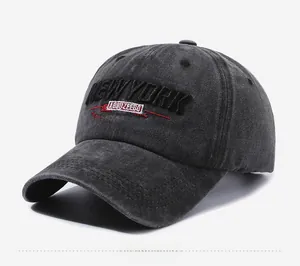 Detail of vintage washed cotton baseball cap with 3D New York embroidery and distressed fabric