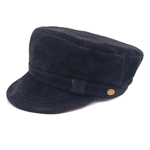 Classic black suede newsboy cap with vintage gold button detail on a white background