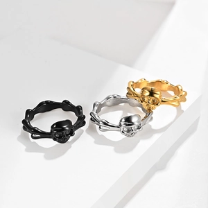 Punk skull rings in black, gold, and silver finishes with unique bone pattern design