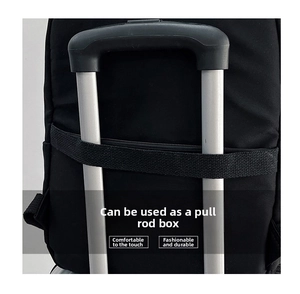 Detail showing the luggage strap on the back of the black business backpack for travel