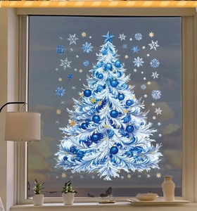 Detailed close-up of blue and white Christmas tree window stickers with snowflake decals