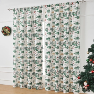 White Christmas curtains with green trees and red stars in a festive home setting