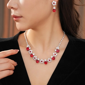 Detailed view of luxury zircon flower necklace and earrings set on female model