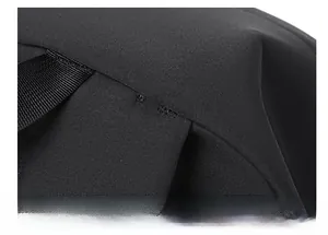 Close-up of durable black fabric texture and high-quality reinforced stitching on the backpack