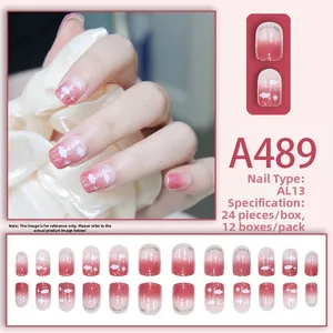 Short gradient press-on nails featuring white clouds, starbursts, and silver glitter finish