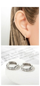 Close-up of silver earrings with marquise-cut cubic zirconia and model wearing shot
