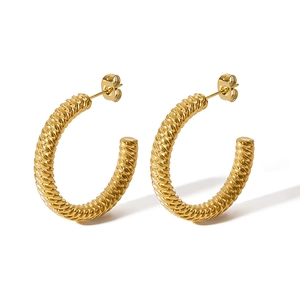 Minimalist 18k gold plated stainless steel twisted hoop earrings on white background