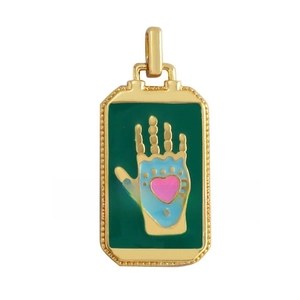 Detail of tarot card pendant with hand holding heart in gold plated brass and zircon