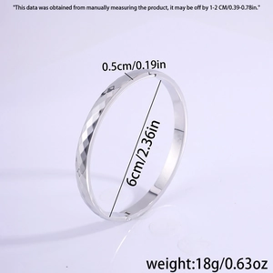 Detail view of 6cm inner diameter silver titanium steel bangle with rhombus texture