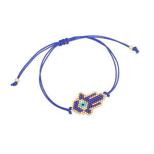 Blue woven beaded Hamsa Hand bracelet with evil eye symbol on a clean white background